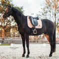 Load image into Gallery viewer, Rose Quartz Saddle Pad by Southlake Paws on a black horse, featuring a quilted design and a black saddle.