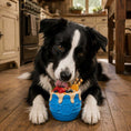 Load image into Gallery viewer, Honey Pot Dog eCup Treat Dispenser by Southlake Paws, blue rubber toy with treats, dog licking it in a cozy kitchen setting.