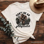 Don't Be a Sasquatch Funny T-Shirt, Retro Bigfoot White and Natural Tee for Outdoor and Camping Dads