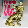 Load image into Gallery viewer, Gold dog figurine in front of a book titled 'Thank You Andy Warhol' by Catherine