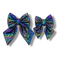 Load image into Gallery viewer, Southlake Paws Mystical Haze - Leather Flower Tie features two iridescent bows in vibrant purple, green, and blue hues.