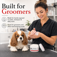 Load image into Gallery viewer, Southlake Paws Groomers Hands Butter - Leave-In Hand Moisturizer in a jar, with a groomer applying it while a dog sits beside