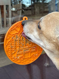 Load image into Gallery viewer, Enrichment lick mat for dogs and cats featuring a retro van design, orange color, with suction cups for attachment.