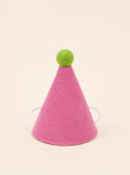 Load image into Gallery viewer, Pink felt party hat with a green pom-pom on top and elastic straps for secure wear, designed for pets by Southlake Paws.