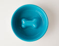 Load image into Gallery viewer, Blue slow feeder dog bowl by Southlake Paws, featuring an anti-slip stainless steel base and a bone-shaped design inside.