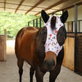 Load image into Gallery viewer, Lycra horse fly mask with ears featuring a floral design, fitted on a brown horse in a barn setting.