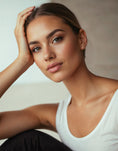 Load image into Gallery viewer, 14K Gold Paw Print Stud Earrings with Screw Backs worn by a woman, showcasing a close-up of her face and earrings.