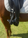 Load image into Gallery viewer, Equisole EXternal-Weighted Training Aid by Southlake Paws, featuring a rider's boot in a stirrup on a horse.
