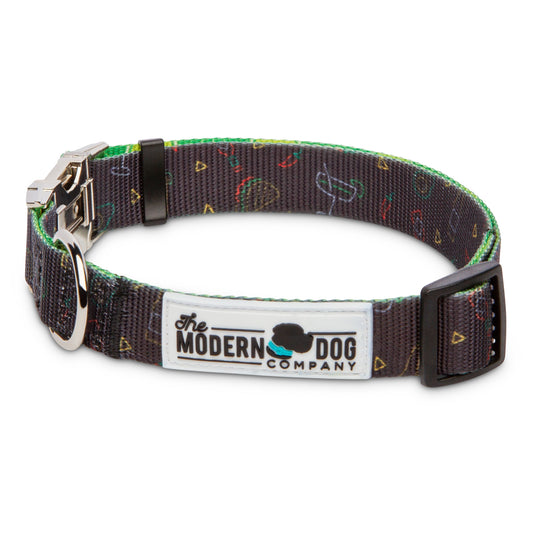 Retro Taco Tuesday Collar by The Modern Dog Company features a colorful taco print on a dark background with a sturdy buckle.