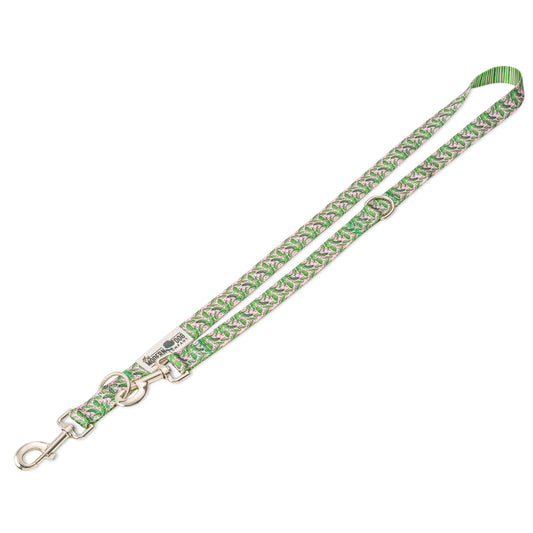 Pink Tropics Leash by The Modern Dog Company featuring a vibrant tropical pattern with green accents and a metal clip.