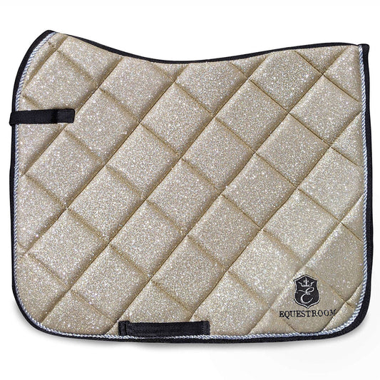 Champagne Saddle Pad by Southlake Paws, featuring a sparkling gold surface with a quilted design and black trim.