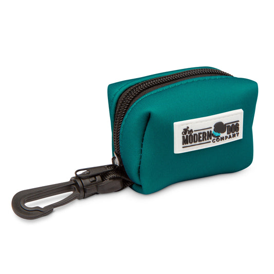 Forest Green Poop Bag Holder by The Modern Dog Company, featuring a zippered design and clip for easy attachment.