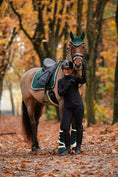 Load image into Gallery viewer, Southlake Paws Pine Grove Saddle Pad on a horse, with a rider in a black outfit, surrounded by autumn foliage.

