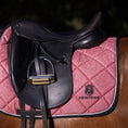 Load image into Gallery viewer, Rose Quartz Saddle Pad by Southlake Paws, featuring a sparkling pink design with a black saddle and stirrup.

