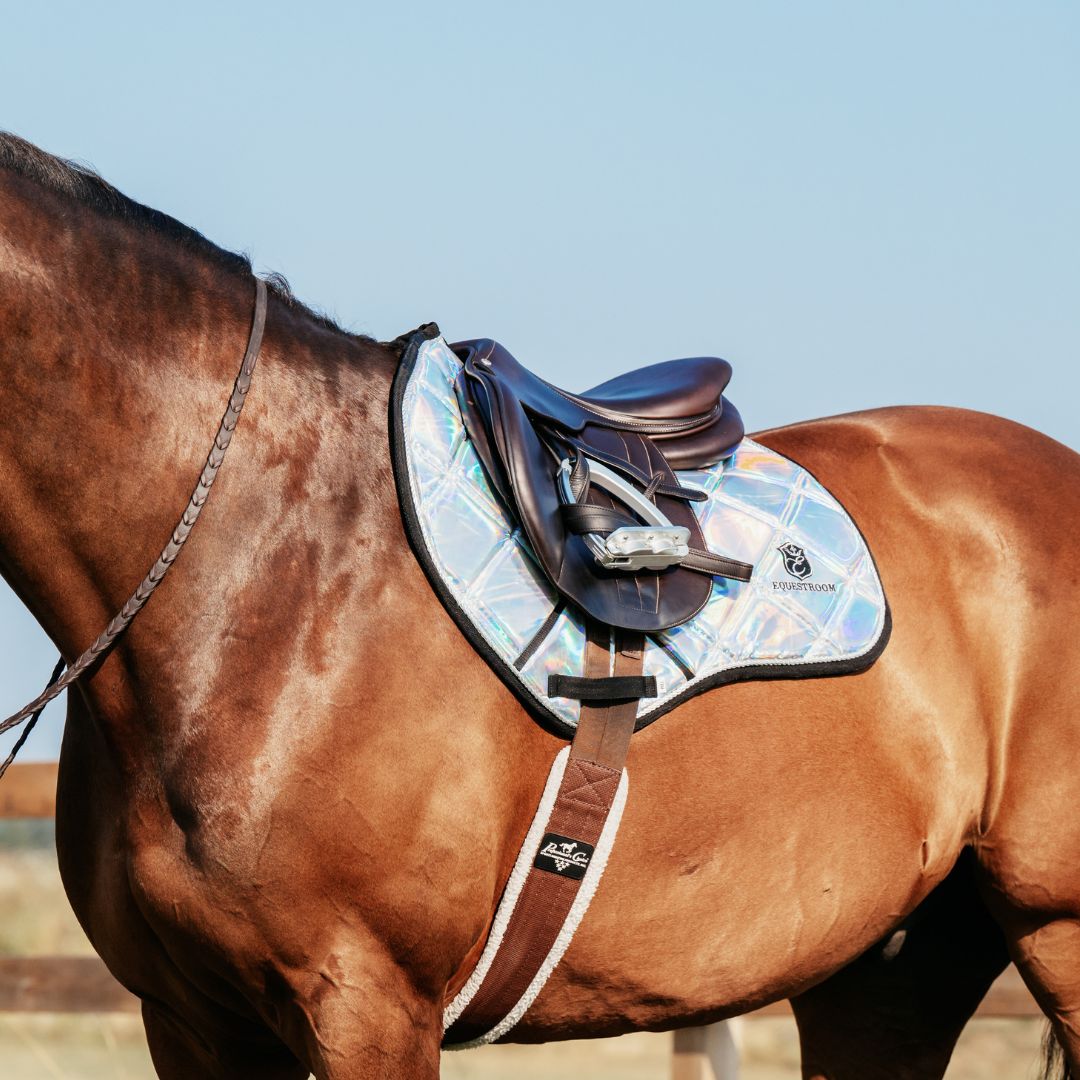 Holographic Saddle Pad by Southlake Paws on a brown horse, featuring a shiny, iridescent design and a brown saddle.