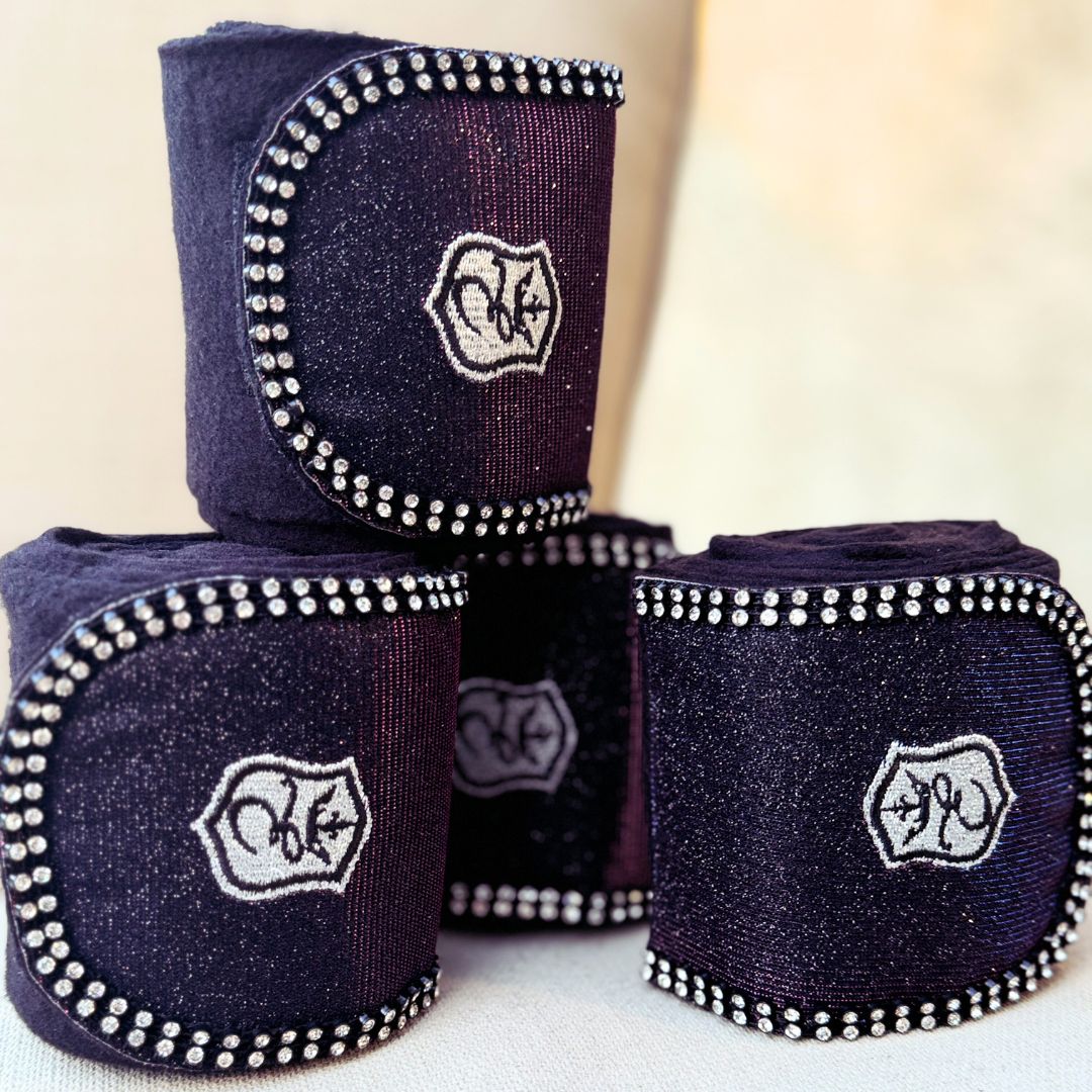 Southlake Paws Ultraviolet Polo Wraps in dark purple with silver embellishments and logo, stacked in a stylish arrangement.