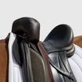 Load image into Gallery viewer, Sally Batton Pommel Blocker by Southlake Paws, featuring a padded leather design for added comfort and support on a saddle.
