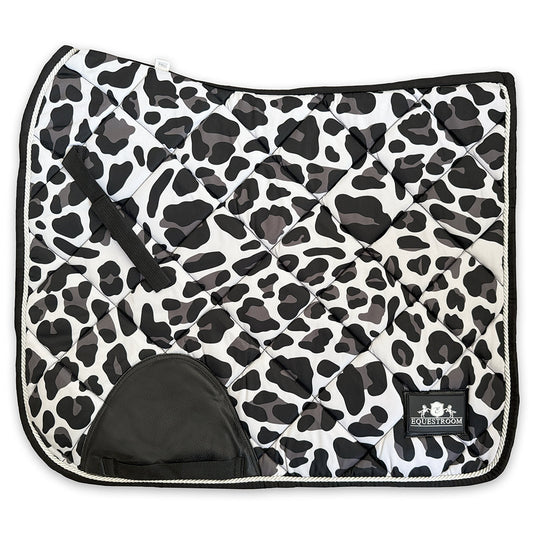 Black and white cheetah print saddle pad by Southlake Paws, featuring a quilted design and a black trim.