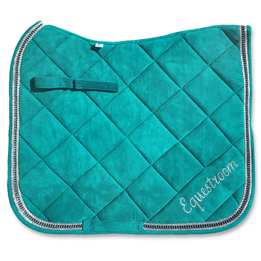 Teal saddle pad by Southlake Paws with quilted design and silver trim, featuring "Equestroom" embroidery.