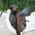 Load image into Gallery viewer, Sally Batton Pommel Blocker by Southlake Paws, a brown equestrian saddle accessory on a horse's saddle pad.

