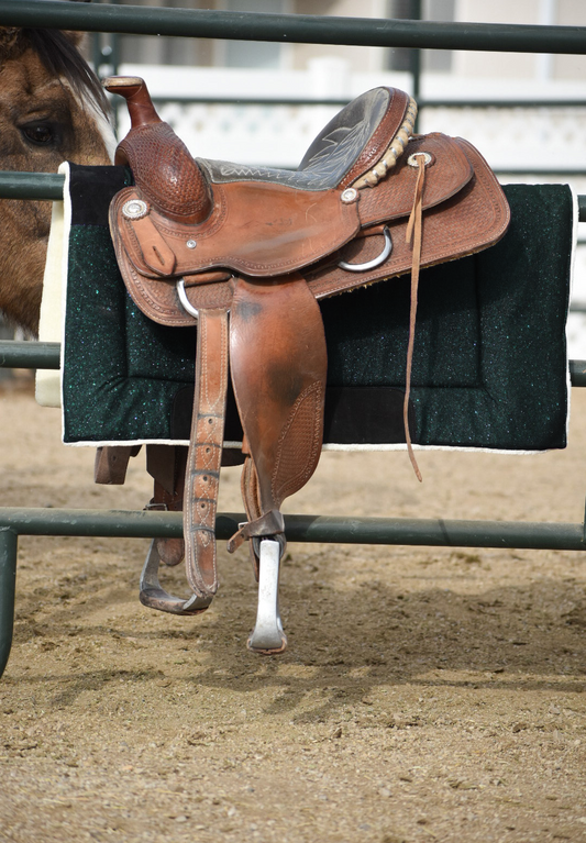 Jade Green Western Saddle Pad by Southlake Paws, displayed on a saddle, featuring a textured green surface and black trim.