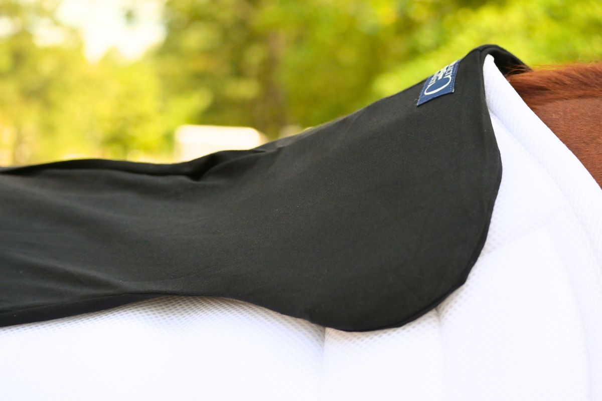 Southlake Paws VIP Pad Covers featuring a black top layer, designed for comfort and protection on a horse's back.