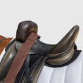 Load image into Gallery viewer, Sally Batton Pommel Blocker by Southlake Paws, featuring a saddle with a brown leather pommel blocker attached.
