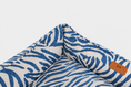 Load image into Gallery viewer, Chester & Lee | Velvet Sleeper Dog Bed Blue & White Animal Print
