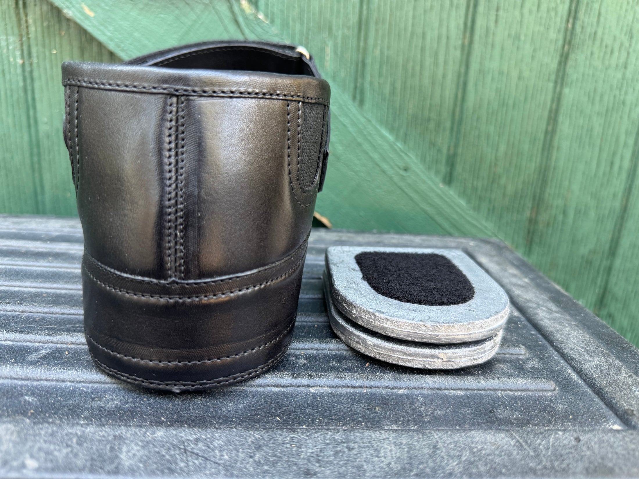 Equisole External-Weighted Training Aid by Southlake Paws, featuring a black boot and removable weighted inserts.