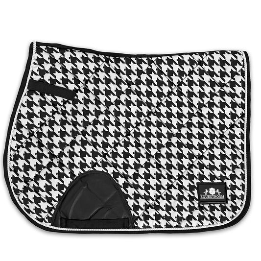 Black and white herringbone saddle pad with quilted design and a black trim, featuring a logo patch.