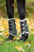 Load image into Gallery viewer, Jade Green Boots by Southlake Paws, featuring a padded design with adjustable straps for horse leg protection.
