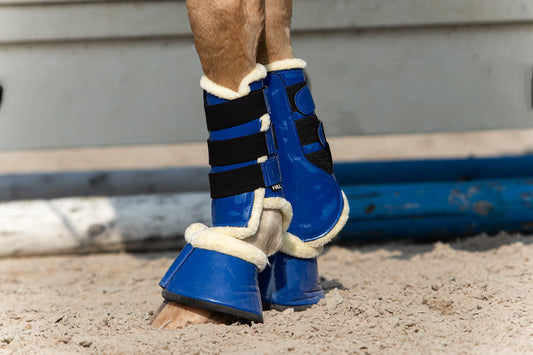 Majorelle Blue Bell Boots by Southlake Paws, featuring a vibrant blue design with black straps and soft lining for horse prot