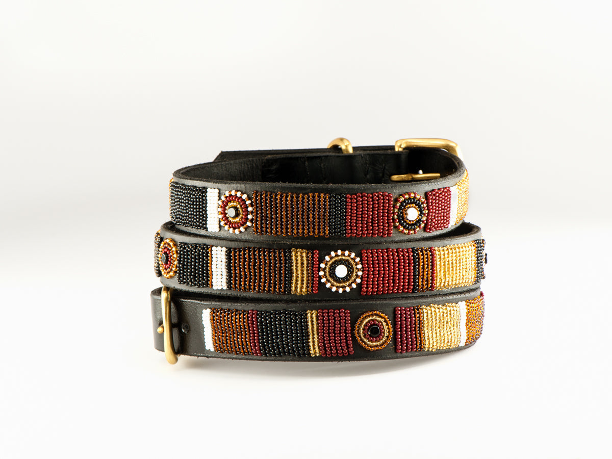 Southlake Paws TKC Topi Belt Standard Width featuring intricate beadwork in red, gold, and black on a black leather base.