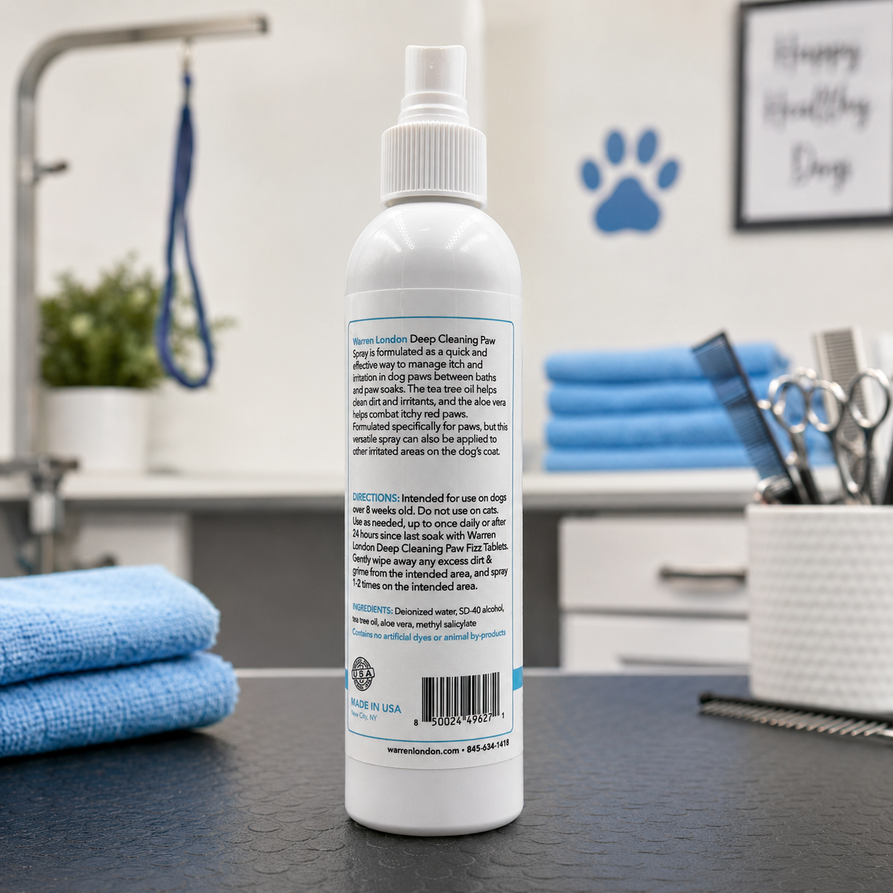 Southlake Paws Deep Cleaning Paw Spray for Dogs in a white spray bottle with instructions on the back, set against a grooming