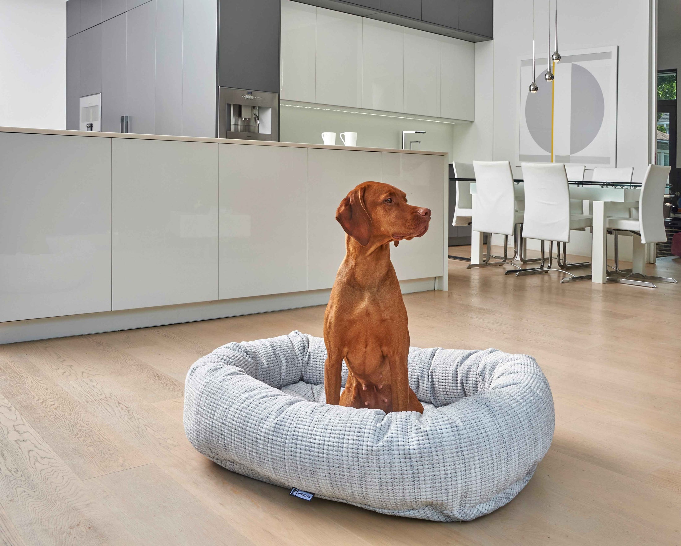 Bowsers Soft Textures Calming Donut Dog Bed in grey-sheepskin