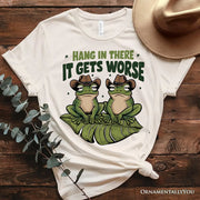 Hang In There It Gets Worse T-Shirt, White and Natural Funny Frog Tee with Dark Millennial Humor 