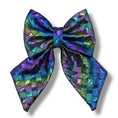 Load image into Gallery viewer, Southlake Paws Mystical Haze - Leather Flower Tie features a vibrant, iridescent bow with a woven texture in purple and green
