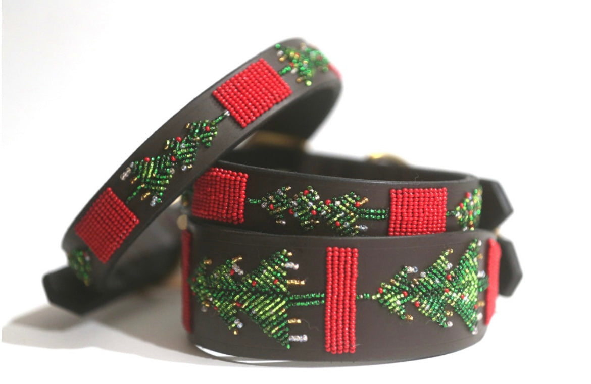 Three holiday beaded belts from Southlake Paws featuring festive green trees and red accents on a dark background.