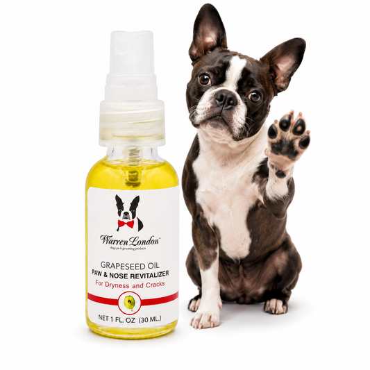 Grapeseed Oil Paw & Nose Revitalizer by Southlake Paws in a spray bottle next to a cute dog raising a paw.