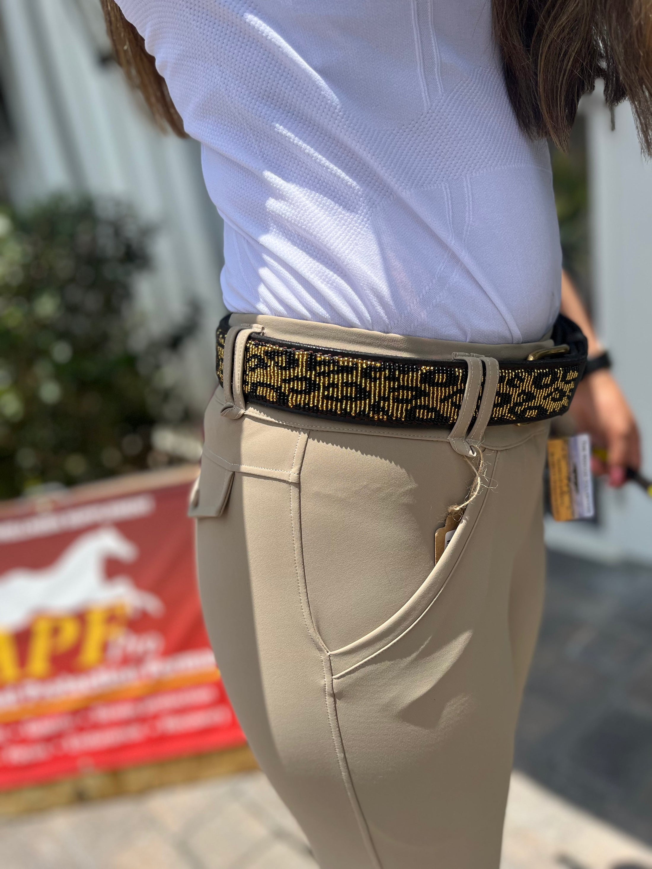 Wide-width TKC Leopard Belt by Southlake Paws, featuring a stylish leopard print, worn with beige pants.