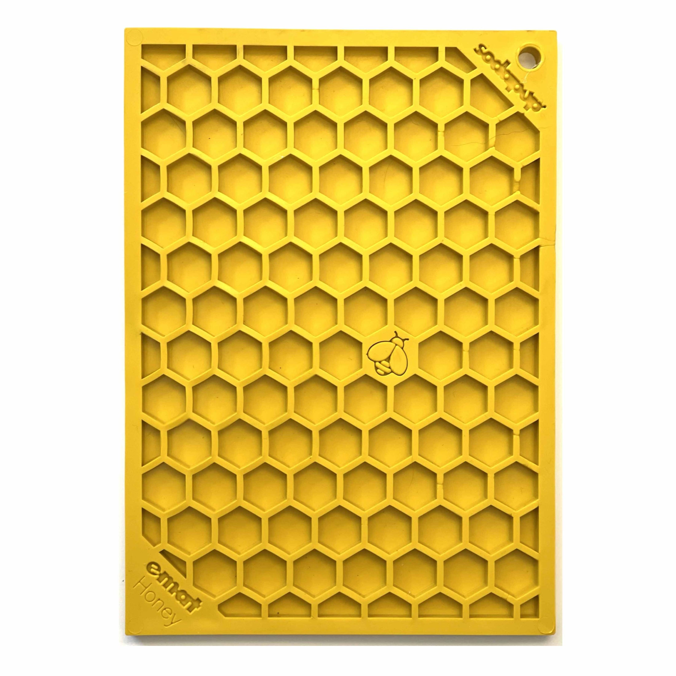 Yellow honeycomb-patterned silicone enrichment lick mat for dogs and cats, designed for anxiety relief and interactive play.