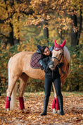Load image into Gallery viewer, Burgundy Fly Hat by Southlake Paws on a horse, with a rider in a black jacket and leggings, surrounded by autumn leaves.
