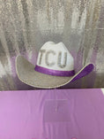 Load image into Gallery viewer, White cowboy hat with 'TCU' on a glittery background
