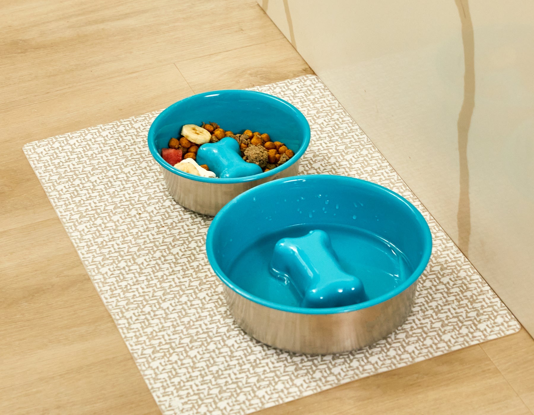Southlake Paws Slow Feeder Dog Bowl in blue, featuring an anti-slip stainless steel base and a bone-shaped design.