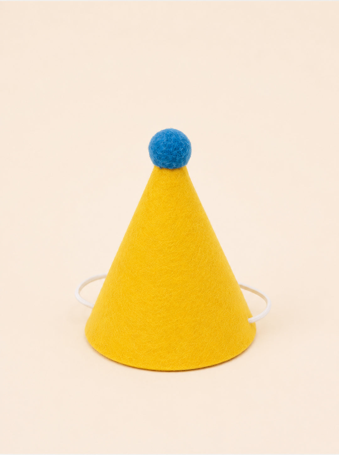 Yellow felt party hat with a blue pom-pom on top and elastic straps for secure wear. Ideal for pet celebrations.