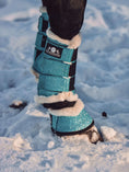 Load image into Gallery viewer, Baby Blue Bell Boots by Southlake Paws, featuring a glittery design with fur lining, designed for dog paw protection in snow.
