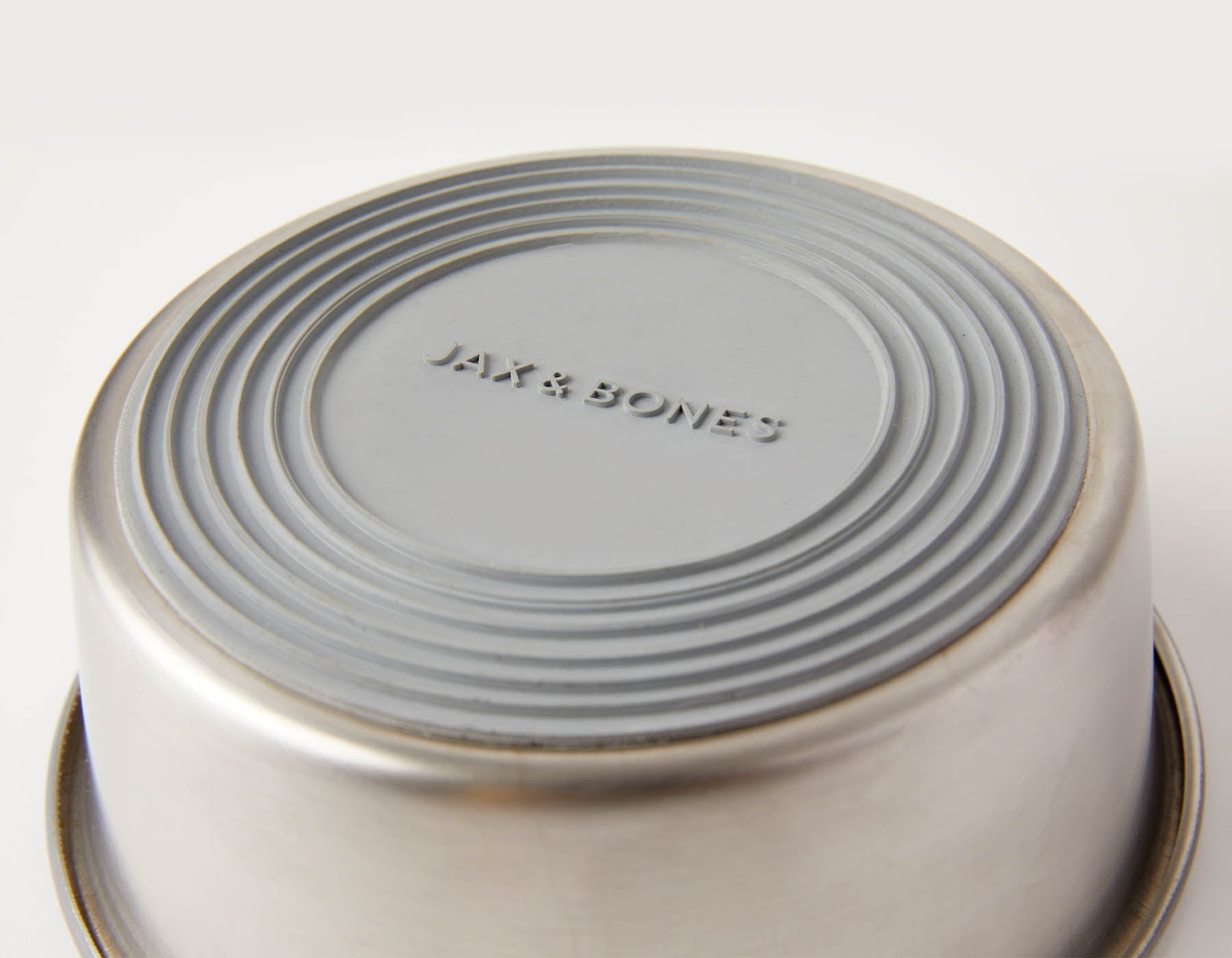 Slow Feeder Dog Bowl in orange, made of anti-slip stainless steel with a textured design on top.