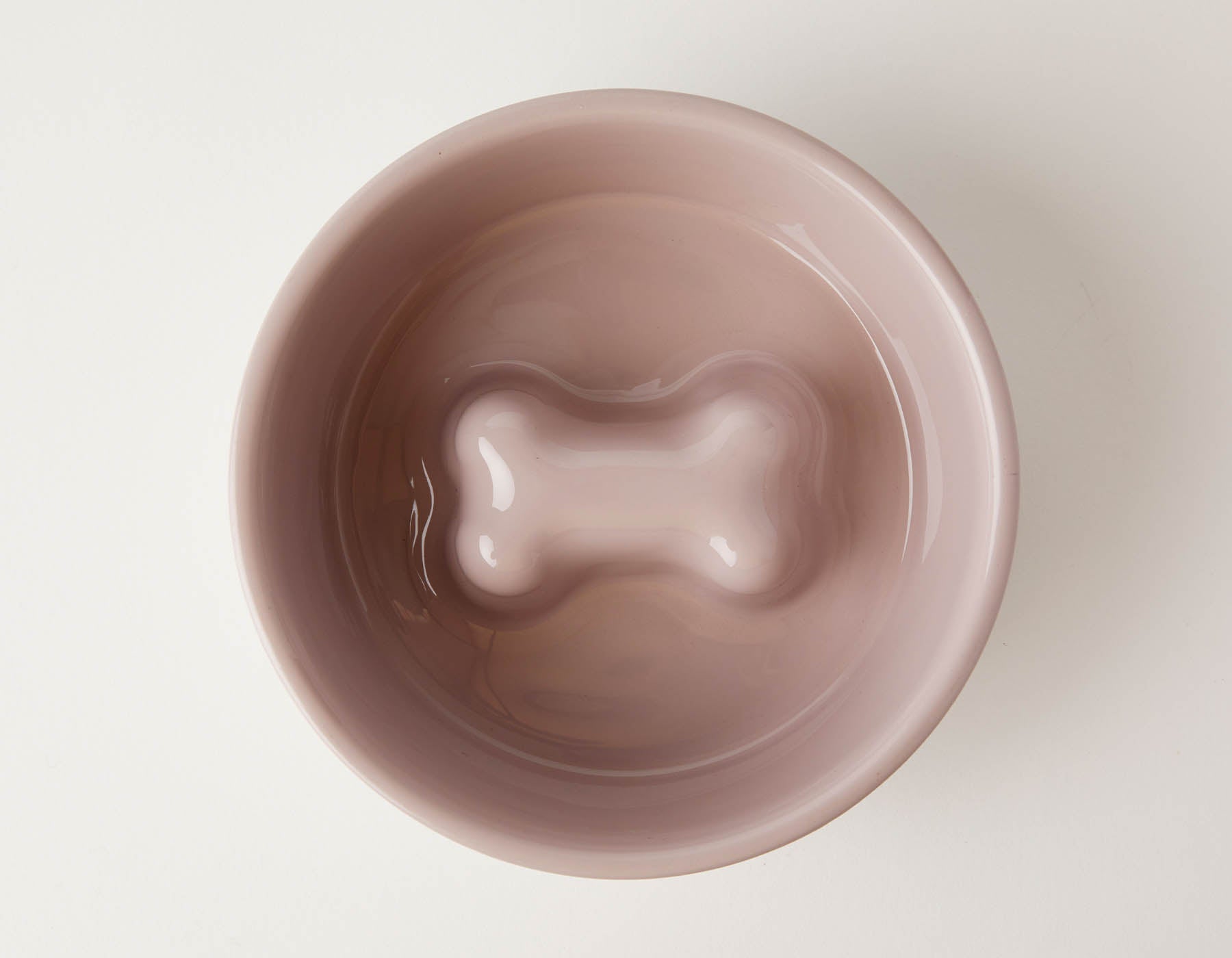 Slow Feeder Dog Bowl Pink by Southlake Paws, featuring an anti-slip stainless steel design with a bone-shaped insert.