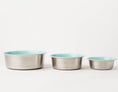 Load image into Gallery viewer, Slow Feeder Dog Bowl in teal with anti-slip stainless steel design, featuring three different sizes stacked together.
