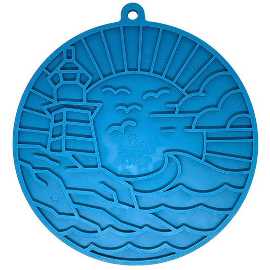 Blue circular enrichment lick mat featuring a lighthouse design with waves and clouds, equipped with suction cups for stabili